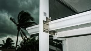 Close-up of a hurricane-rated aluminum pool screen enclosure frame at a Miami home
