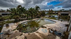 Flooded residential swimming pool after tropical storm in Miami with debris and murky water