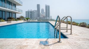 Oceanfront condo pool with stainless rails in Sunny Isles Beach, Miami